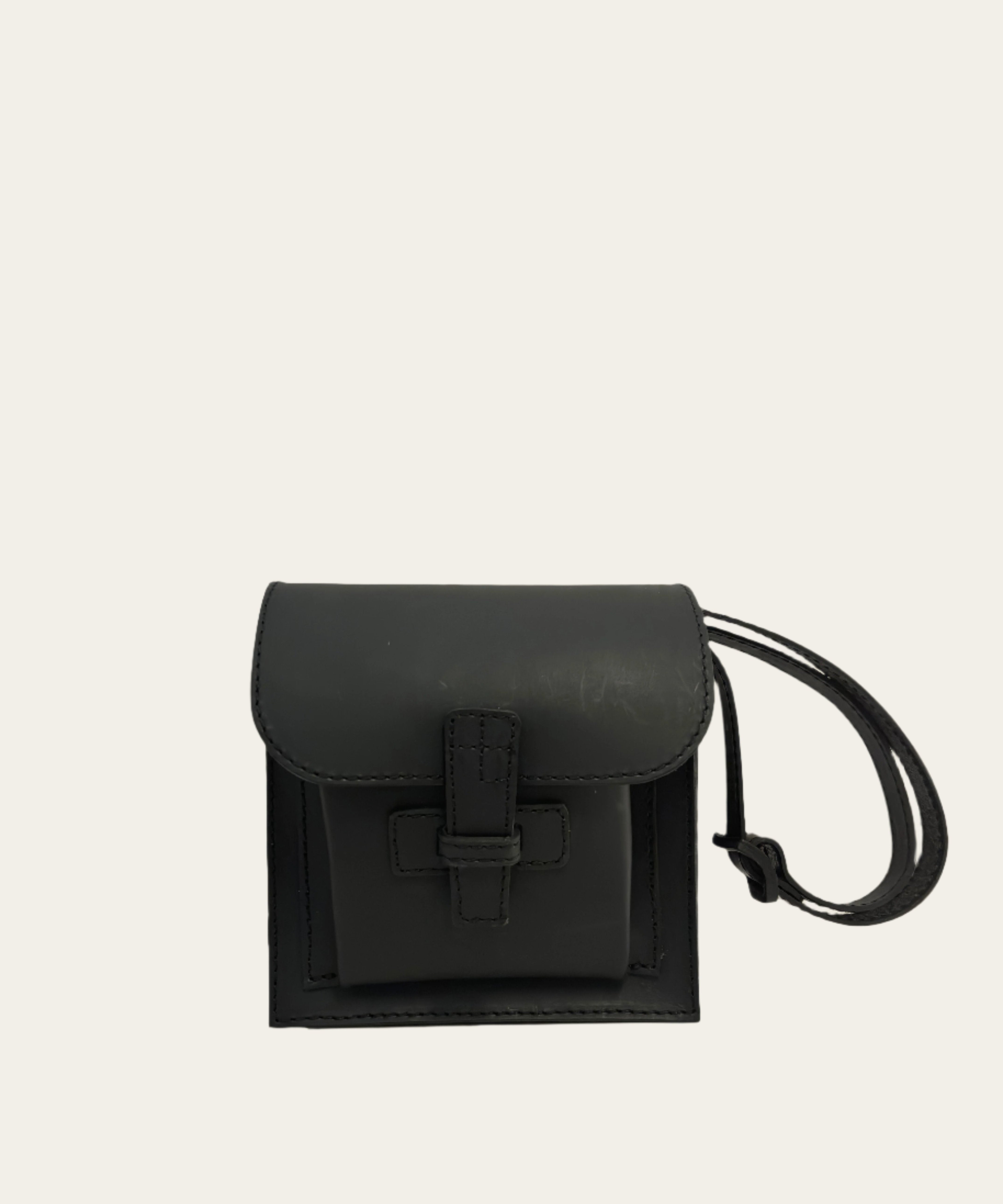 A black leather crossbody bag with an adjustable strap.