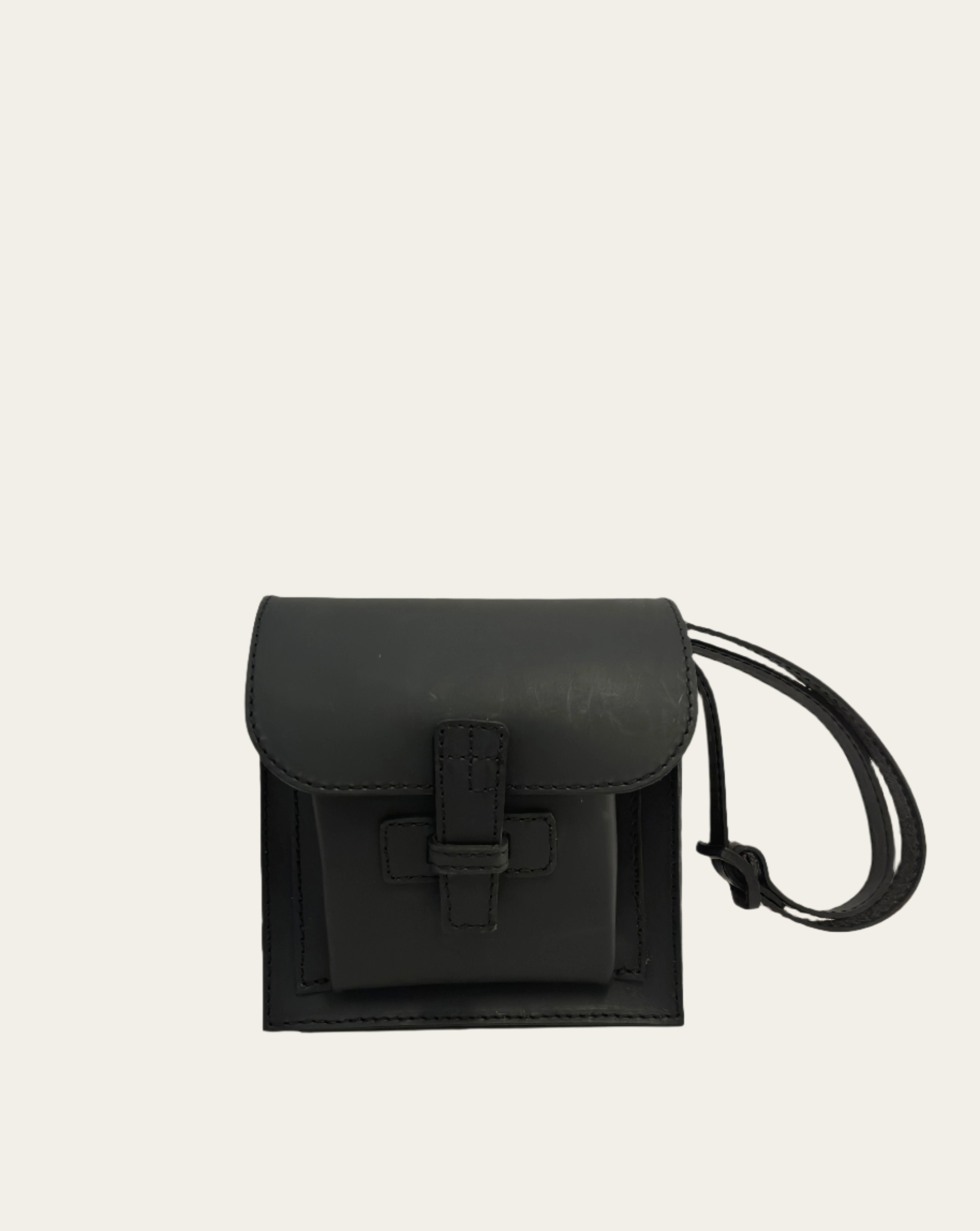 A black leather crossbody bag with an adjustable strap.